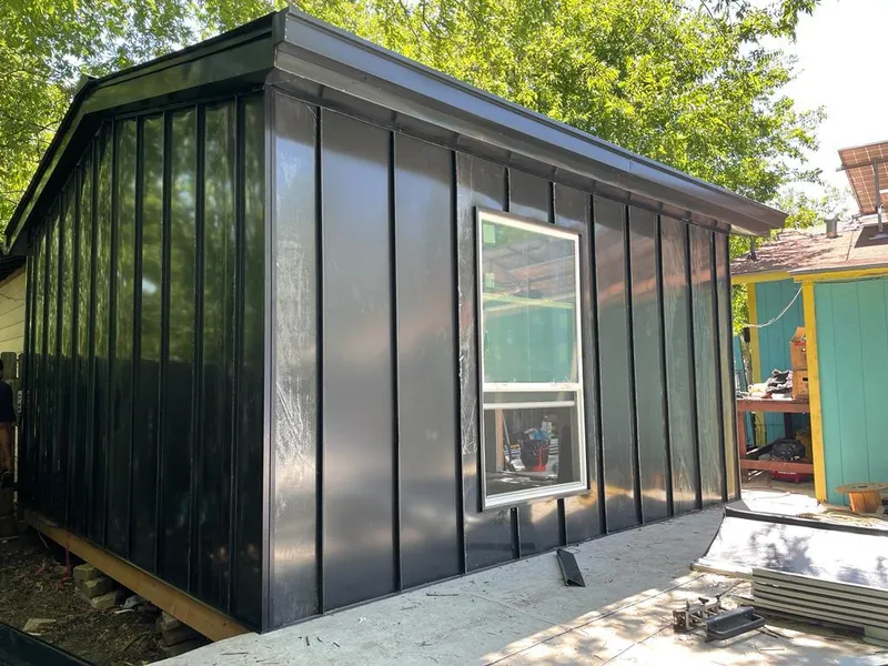 Black standing seam metal wall panels for Roof Inspection in San Carlos