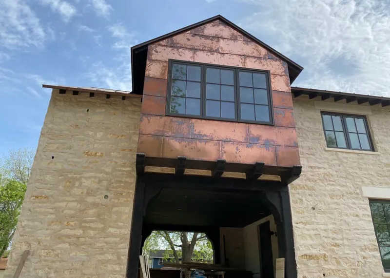 Copper metal panel facade on a stone building for Metal Roof Coating in San Carlos